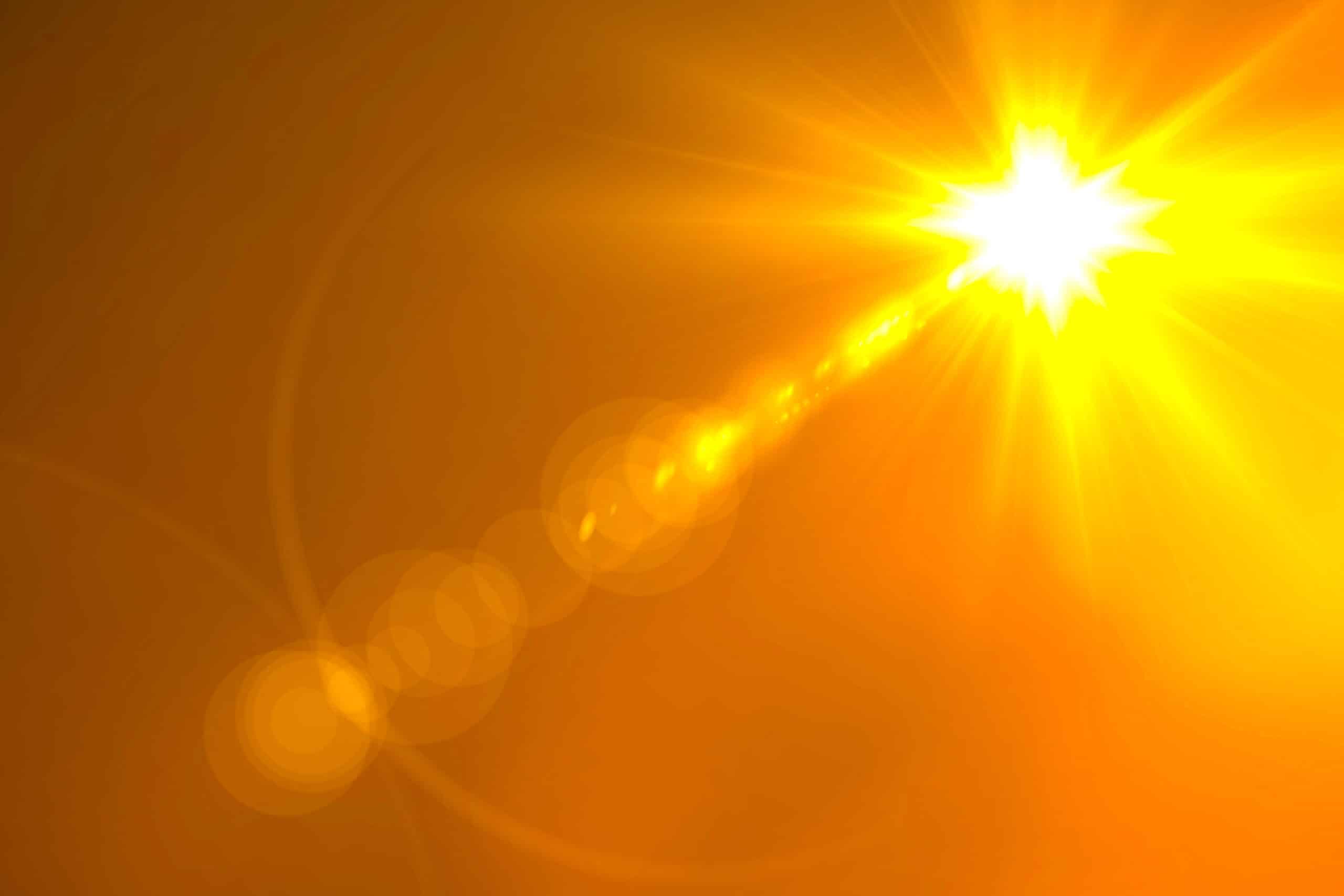 A bright sun shows in a brilliant orange and yellow sky with yellow rays and lens flare artifacts emphasizing Type UVUA conduit jacket resistance to prolonged UV sunlight exposure.