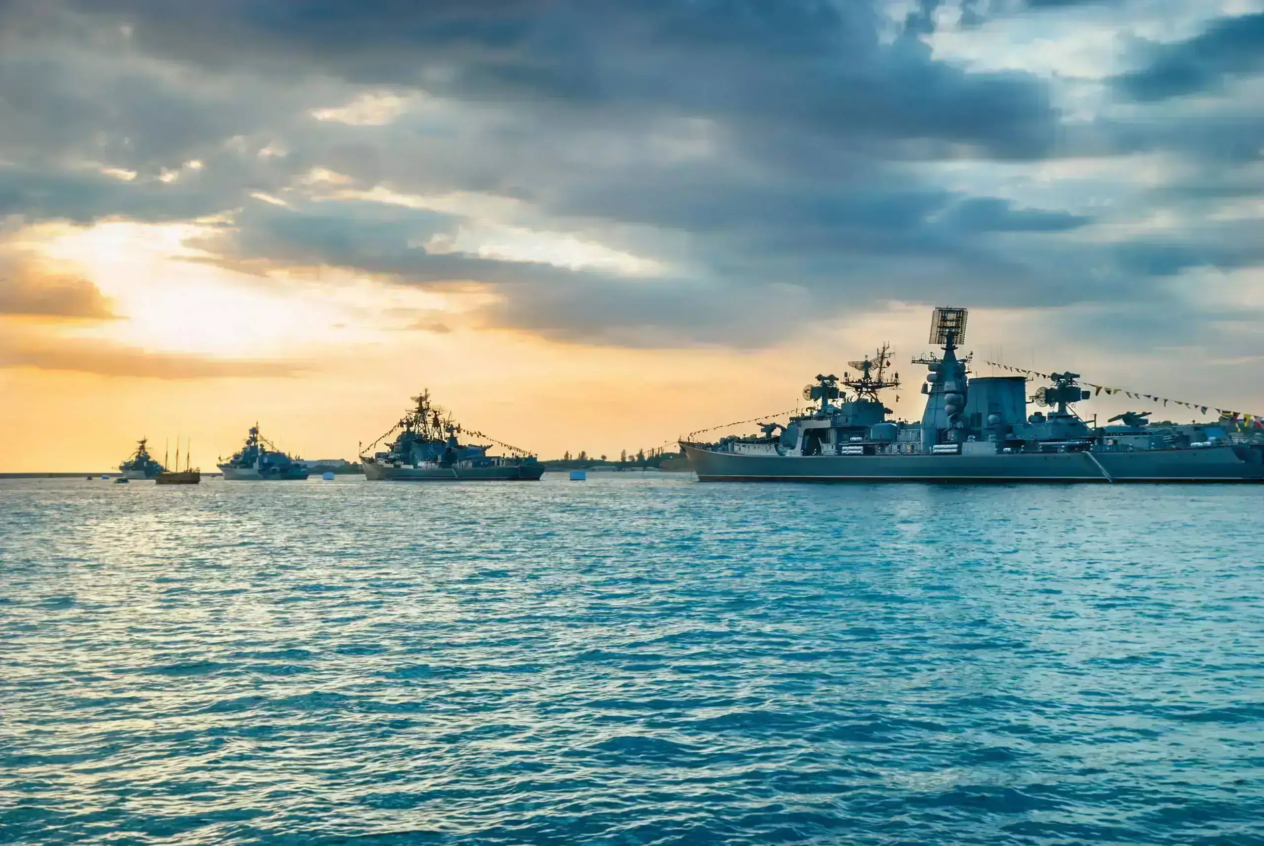 Military navy ships in a sea bay Military navy ships in a sea bay